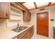 A view of the kitchen sink, cabinets, and hardware at 3204 Ne 16Th Ave, Ocala, FL 34479