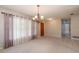 Bright living room featuring carpet floors and decorative curtains at 3204 Ne 16Th Ave, Ocala, FL 34479