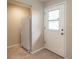 Functional mud room with tile flooring, white refrigerator, and access to the outdoors at 3204 Ne 16Th Ave, Ocala, FL 34479