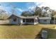 Rear exterior view of home with screened porch at 3204 Ne 16Th Ave, Ocala, FL 34479