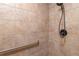 Tile shower featuring an adjustable shower head and a convenient grab bar for added accessibility at 3204 Ne 16Th Ave, Ocala, FL 34479