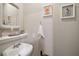 Powder room with a stylish sink and decorative mirror at 3401 Se 49Th Ave, Ocala, FL 34480