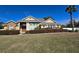 Inviting single-story home featuring well-manicured landscaping and a symmetrical facade against a bright blue sky at 3401 Se 49Th Ave, Ocala, FL 34480