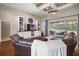 Bright living room showcasing built-in shelving, a large sectional, and sliding glass doors leading to the outdoor patio at 3401 Se 49Th Ave, Ocala, FL 34480