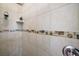 Close up shot of the bathroom shower showing decorative tile and fixtures at 3401 Se 49Th Ave, Ocala, FL 34480