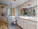 Elegant bathroom with glass-enclosed shower and double vanity sinks at 3832 Se 2Nd St, Ocala, FL 34471