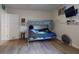 Bedroom with bunk bed, fan, TV, and wood-look flooring at 3832 Se 2Nd St, Ocala, FL 34471