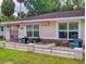 Inviting front porch with decorative stone accents and comfortable seating area at 3832 Se 2Nd St, Ocala, FL 34471