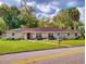 Charming single story home featuring well-manicured lawn and inviting front porch area at 3832 Se 2Nd St, Ocala, FL 34471