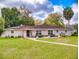 Charming single story home featuring well-manicured lawn and inviting front porch area at 3832 Se 2Nd St, Ocala, FL 34471