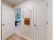 Hallway view featuring a calendar on the wall leading to an open kitchen area at 3832 Se 2Nd St, Ocala, FL 34471