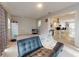 Open-concept living room with tile floors seamlessly connects to the adjacent kitchen and dining area at 3832 Se 2Nd St, Ocala, FL 34471