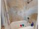 Close-up of a shower, complete with tiled walls and essential toiletries at 3832 Se 2Nd St, Ocala, FL 34471