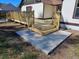 New wooden backyard deck with stairs and concrete landing, providing a transition to the lawn at 4534 Se 13Th St, Ocala, FL 34471