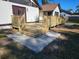 New wooden backyard deck with stairs and concrete landing, providing a transition to the lawn at 4534 Se 13Th St, Ocala, FL 34471