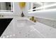 Elegant bathroom featuring dual sinks, black cabinets, gold hardware, and modern lighting at 4534 Se 13Th St, Ocala, FL 34471