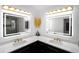 Elegant bathroom featuring dual sinks, black cabinets, gold hardware, and modern lighting at 4534 Se 13Th St, Ocala, FL 34471