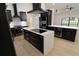 Modern kitchen featuring black cabinetry, white countertops and backsplash, and stainless steel appliances at 4534 Se 13Th St, Ocala, FL 34471