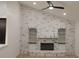 Living room featuring a whitewashed brick fireplace with built-in shelving and cabinets at 4534 Se 13Th St, Ocala, FL 34471