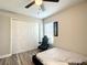 Neutral bedroom featuring a ceiling fan, closet and a window bringing in natural light at 480 Nw 55Th Ave, Ocala, FL 34482