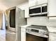 Close-up of a modern kitchen with stainless steel appliances and white subway tile backsplash at 480 Nw 55Th Ave, Ocala, FL 34482