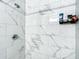 Contemporary shower featuring white marble tile and a sleek shower head at 480 Nw 55Th Ave, Ocala, FL 34482