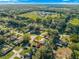 Desirable neighborhood featuring lush trees and well-maintained houses provides an inviting place to call home at 5115 Se 20Th St, Ocala, FL 34480