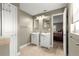 Bathroom featuring dual vanities and an entryway into the main bedroom at 5115 Se 20Th St, Ocala, FL 34480