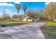 A charming single-story home featuring a long driveway and well-maintained landscaping at 5115 Se 20Th St, Ocala, FL 34480