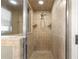 Tiled shower with built-in shelves and glass door offers a spa-like experience at 5115 Se 20Th St, Ocala, FL 34480