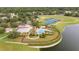 Aerial view of community pool, clubhouse, tennis courts and pond at 5464 Sw 41St St, Ocala, FL 34474