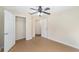 An inviting bedroom featuring an open closet and a fan at 5464 Sw 41St St, Ocala, FL 34474