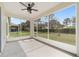 Screened in lanai with ceiling fan and views of the backyard at 5464 Sw 41St St, Ocala, FL 34474