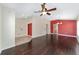 Bright and airy living room with wood floors, a ceiling fan, and views of the adjacent rooms at 5464 Sw 41St St, Ocala, FL 34474