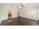 Large main bedroom with a ceiling fan and an en-suite bathroom at 5464 Sw 41St St, Ocala, FL 34474