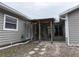 View of the back patio with a wooden pergola and sliding glass doors at 5490 Se Highway 42, Summerfield, FL 34491