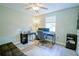 Bedroom converted to an office with a desk, chair, and light wood-look flooring at 5490 Se Highway 42, Summerfield, FL 34491