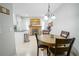 Cozy dining area adjacent to the kitchen, features a fireplace and lots of natural light at 5490 Se Highway 42, Summerfield, FL 34491