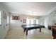 Spacious game room features a pool table, dartboard, and tiled floor at 5490 Se Highway 42, Summerfield, FL 34491