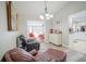 Living room view with pool through the sliding glass doors and bar area at 5490 Se Highway 42, Summerfield, FL 34491