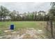 Open pasture area with mature trees and wood post fence at 5490 Se Highway 42, Summerfield, FL 34491