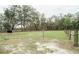 Expansive pasture area with mature trees, a run-in shed and wooden fencing at 5490 Se Highway 42, Summerfield, FL 34491