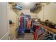 Walk-in closet with shelving, hanging racks, ample storage, and space for organizing clothing and accessories at 5490 Se Highway 42, Summerfield, FL 34491