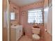 A compact bathroom with a shower and neutral color palette at 5812 Luzon Pl, Orlando, FL 32839