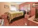 A cozy bedroom with wood floors and natural lighting at 5812 Luzon Pl, Orlando, FL 32839