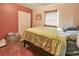 A bedroom with a double bed and wood flooring at 5812 Luzon Pl, Orlando, FL 32839