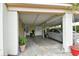 Covered carport featuring ample parking space and storage, with a vehicle parked inside at 5812 Luzon Pl, Orlando, FL 32839