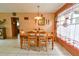 A cozy dining room features neutral tones and light tile flooring at 5812 Luzon Pl, Orlando, FL 32839