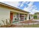 Charming front porch with porch swing, seating, and cozy landscaping featuring a brick-lined walkway with in-ground lighting at 5812 Luzon Pl, Orlando, FL 32839