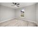 This is a bedroom with a ceiling fan and a window at 6 Dogwood Loop Ave, Ocala, FL 34472